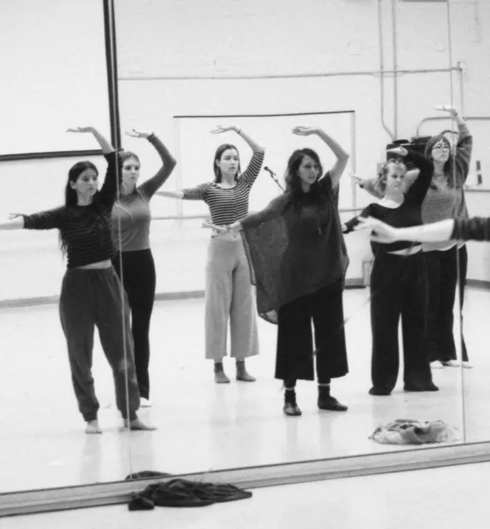 Students working together during a dance class